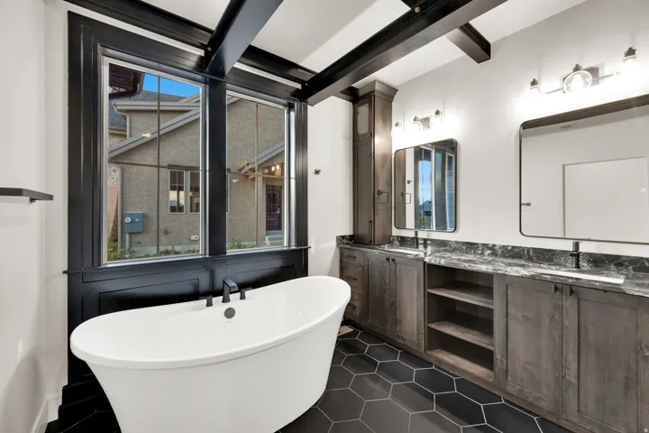 Freestanding soaking tub with a matte black faucet