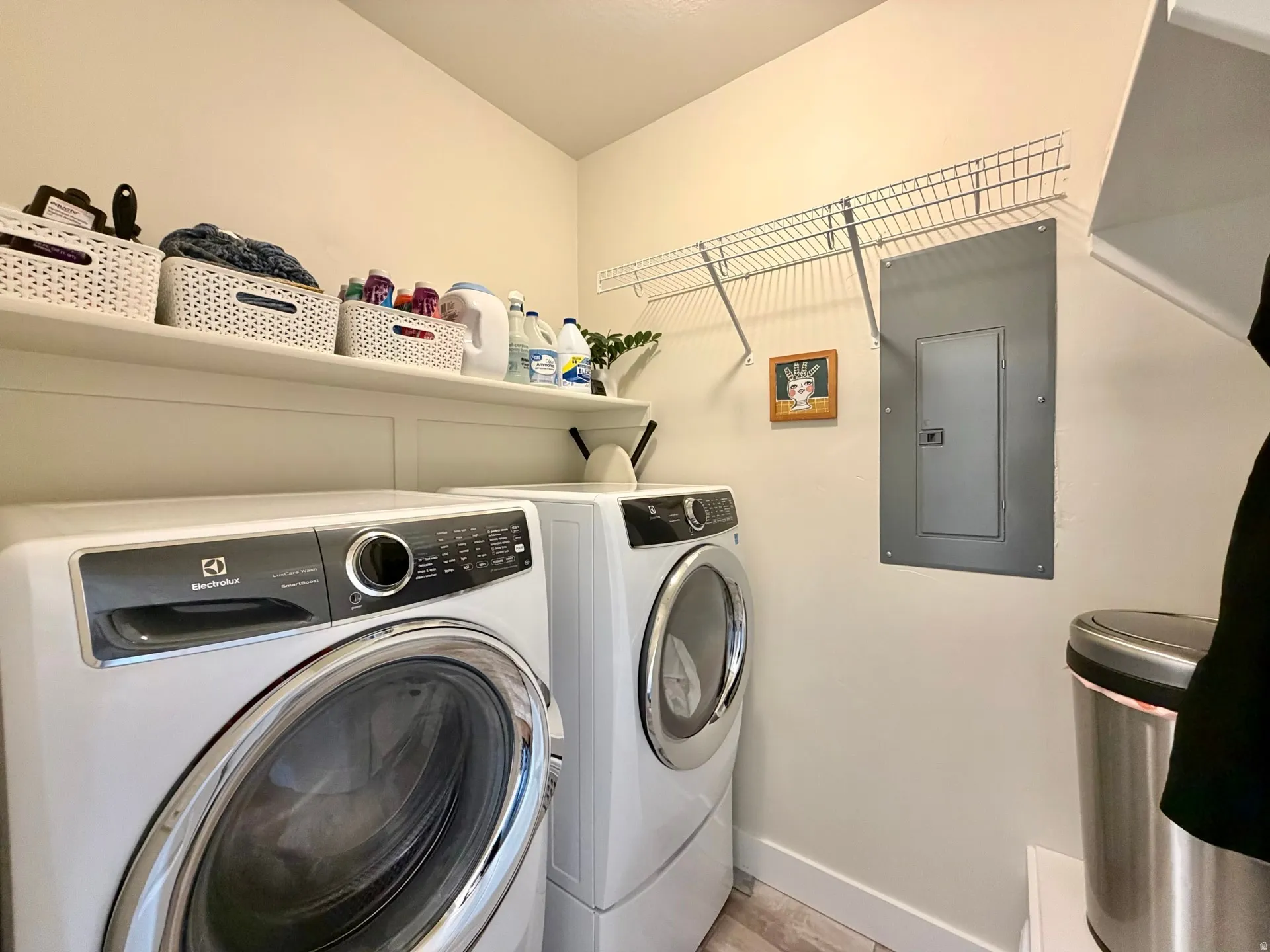 Dedicated laundry area featuring a front-loading washer and dryer set