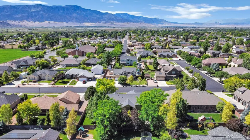 Expansive residential area featuring numerous single-family homes with diverse architectural styles, mature landscaping, and paved streets