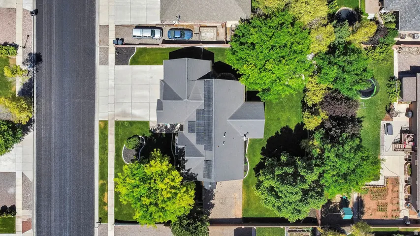 Contemporary home with a dark shingle roof and solar panels