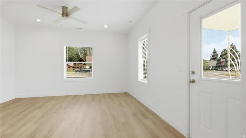 Entryway featuring a white paneled door with a partial glass insert