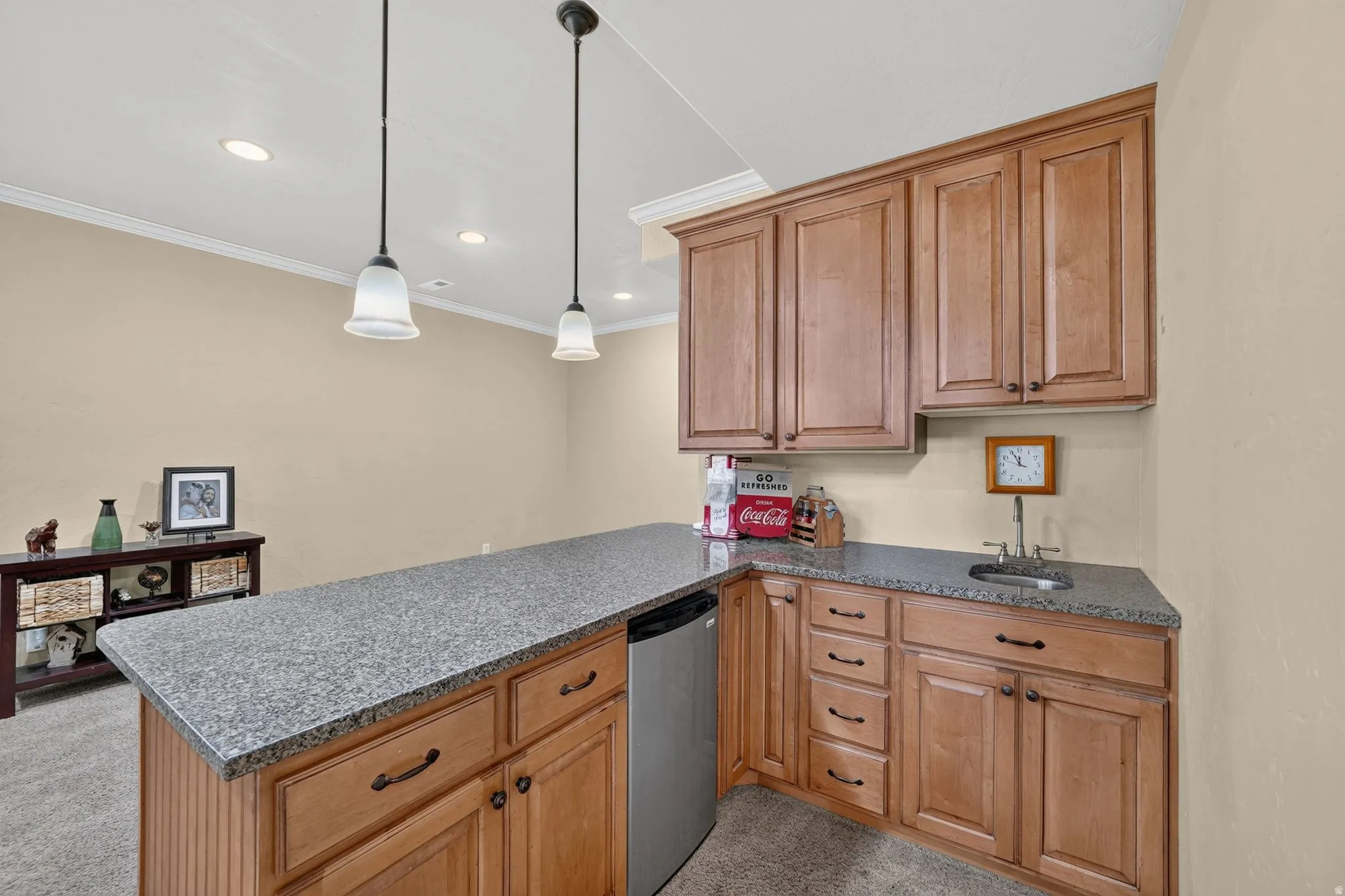 Downstairs kitchenette with fridge