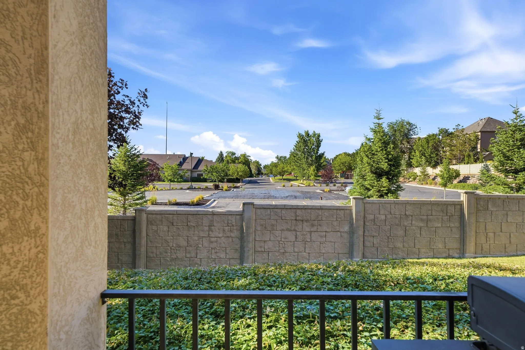 Views from patio showcasing no back neighbors and a quiet parking lot