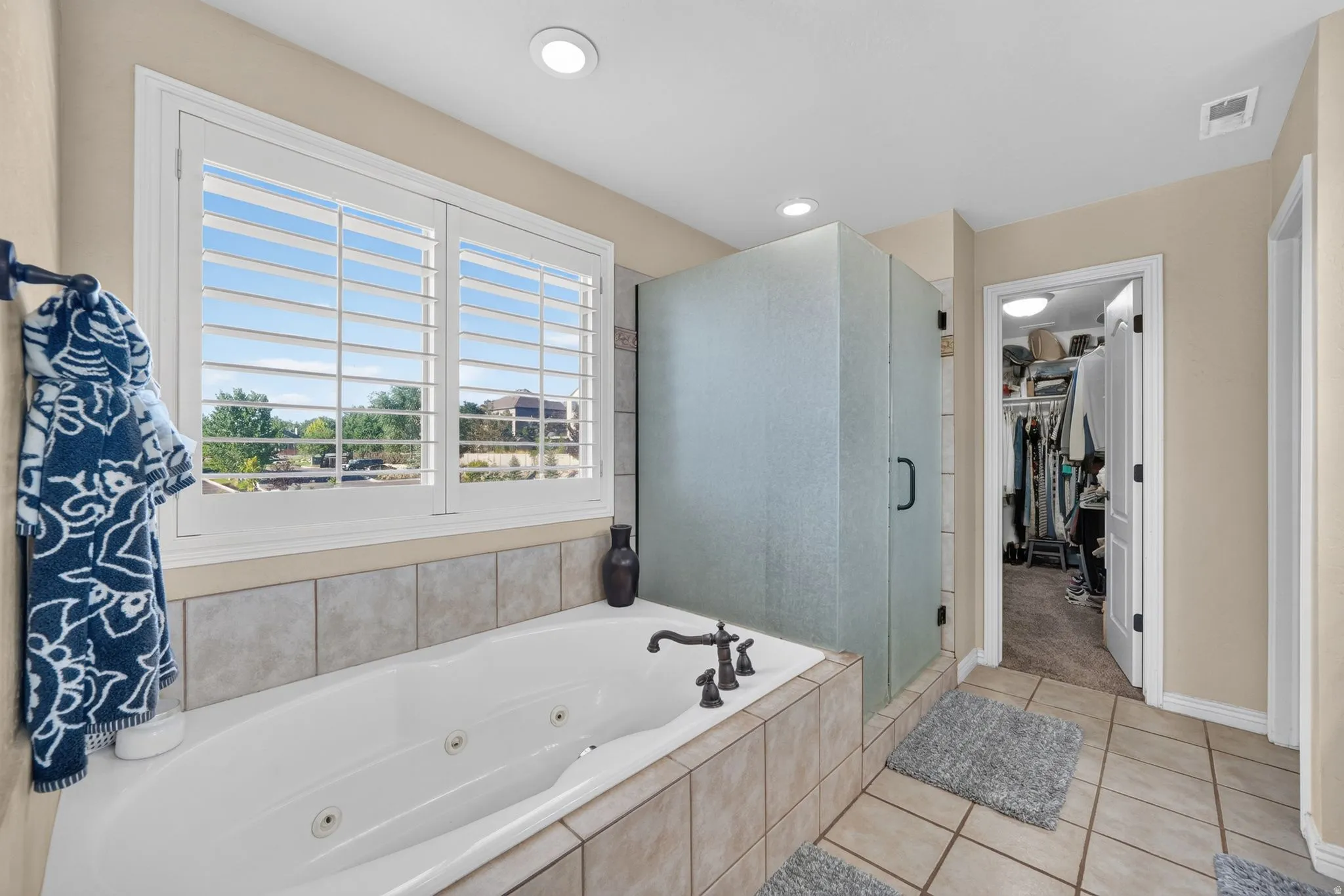 Large sitting tub with natural light and large windows