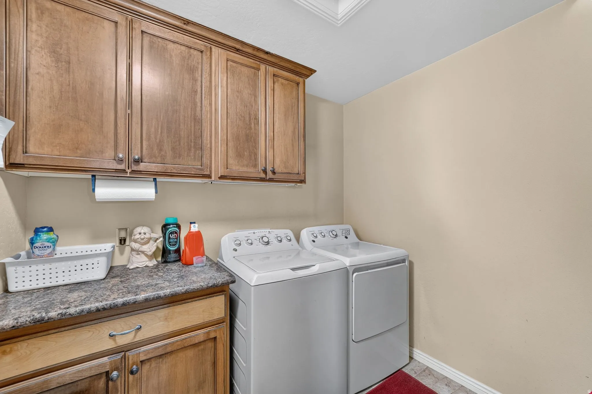 Oversized laundry room with decided hanging and storage shelves