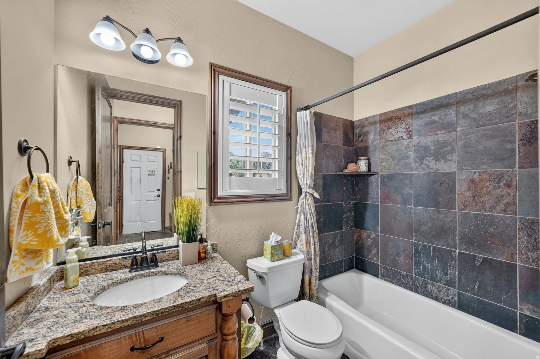 Main level guest bathroom with full walk in shower