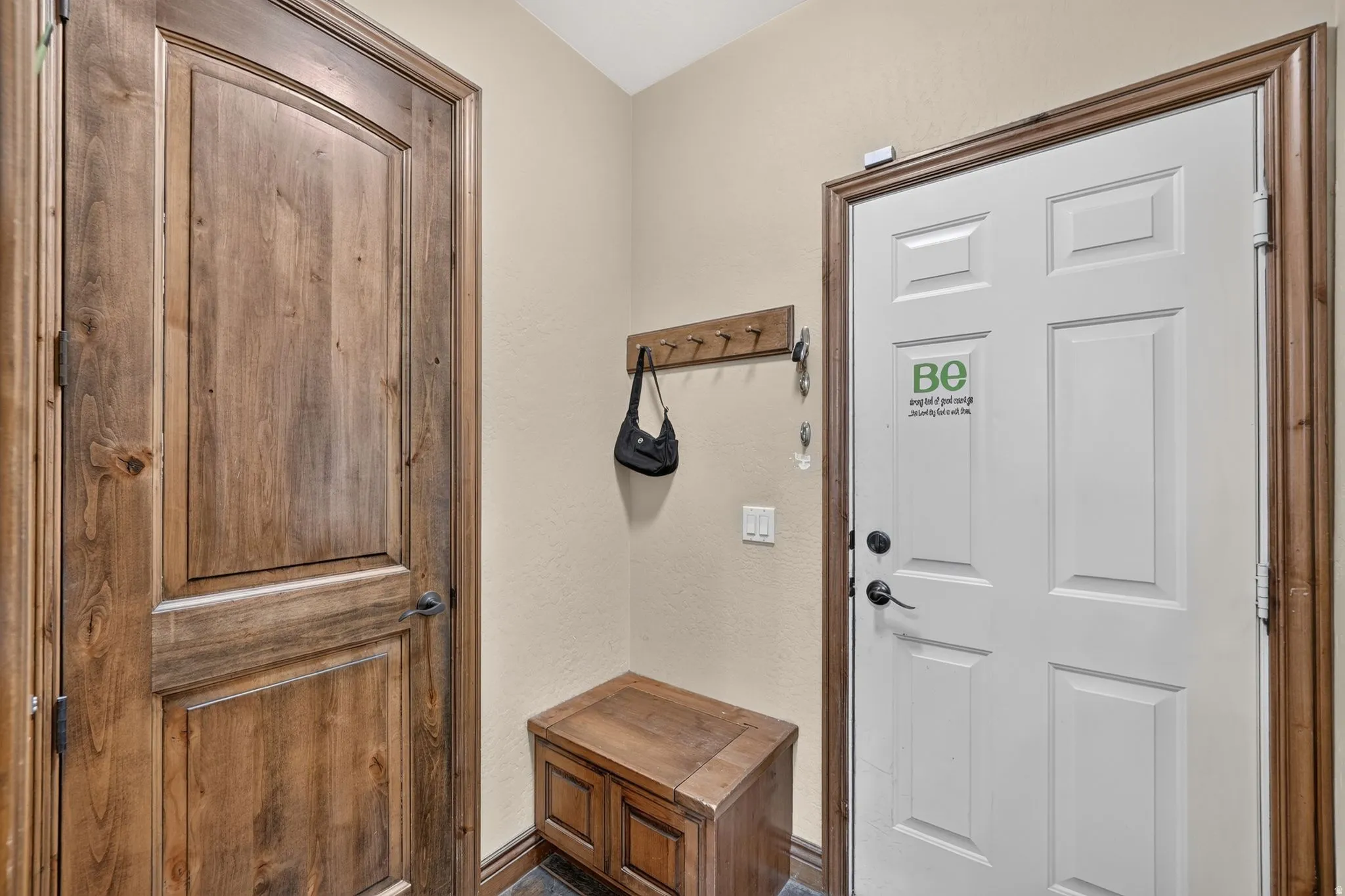 Welcoming mud room and door to the garage