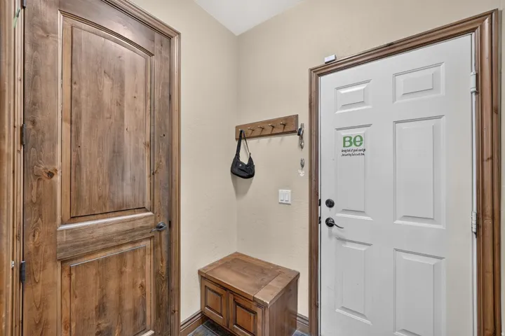 Welcoming mud room and door to the garage