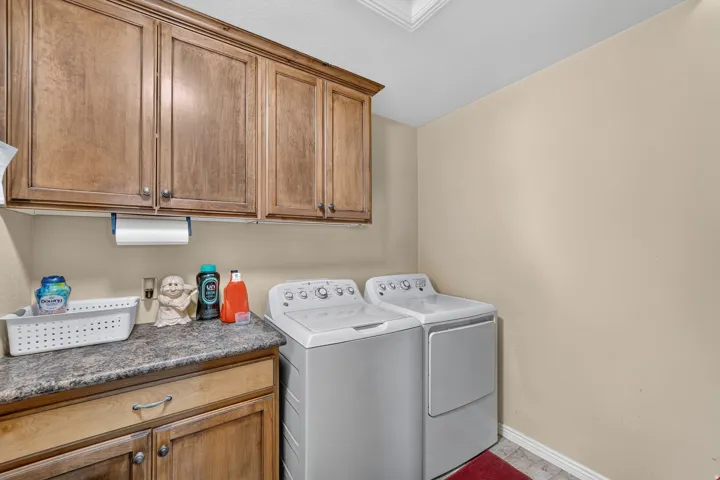 Oversized laundry room with dedicated hanging and storage shelves