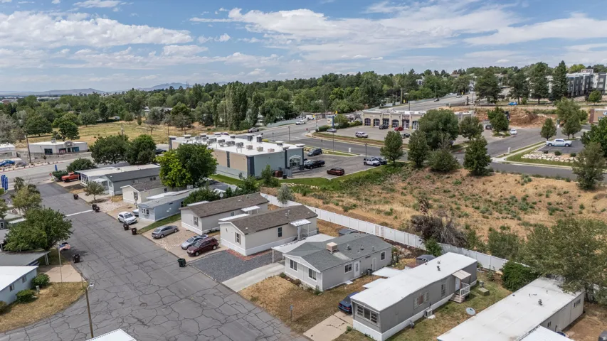 Aerial perspective showcasing a community of single-story residences with paved roads