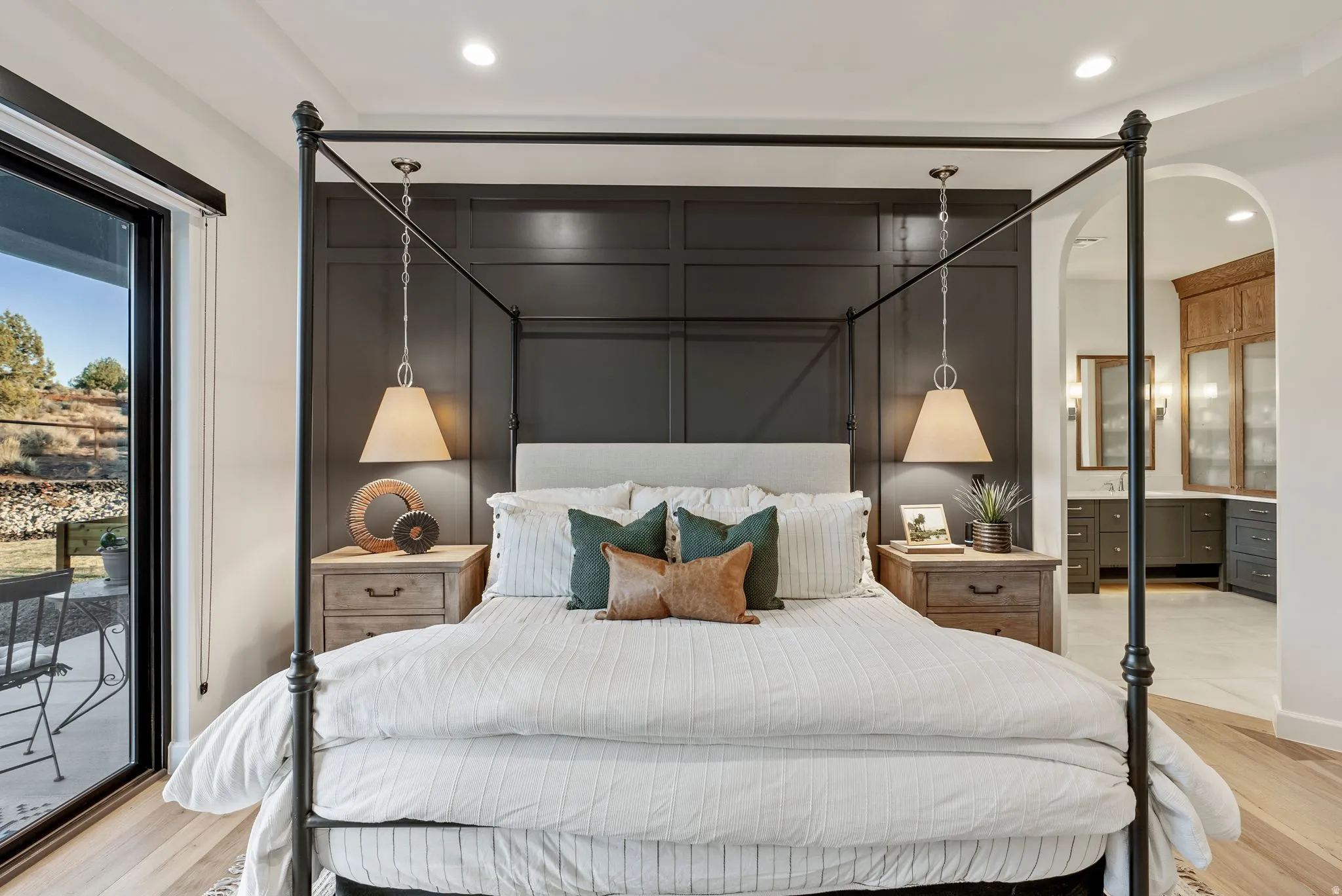 Accent wall with wainscoting and two hanging pendant lights