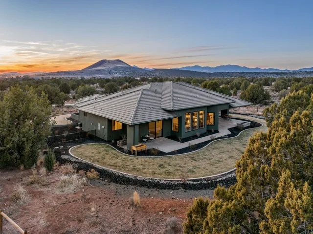 Single-story residence featuring a tile roof and a stucco exterior