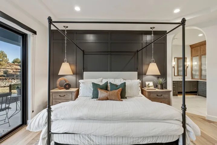 Accent wall with wainscoting and two hanging pendant lights