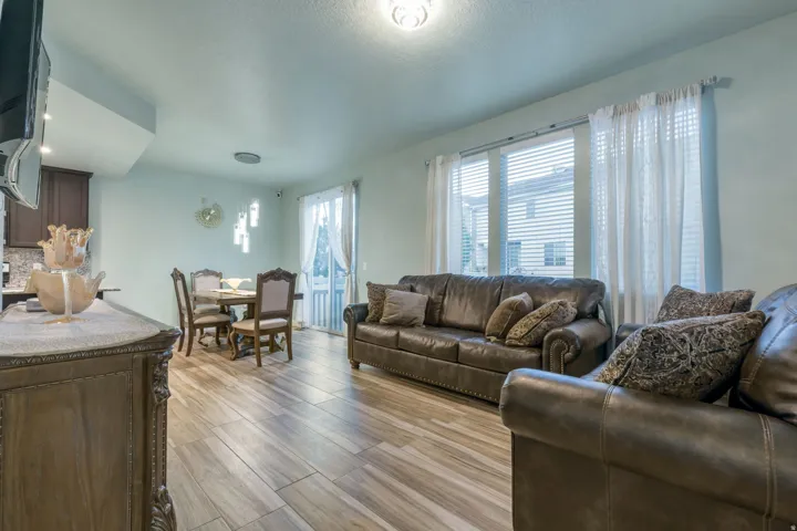 Open-concept living space featuring wood-finish flooring throughout