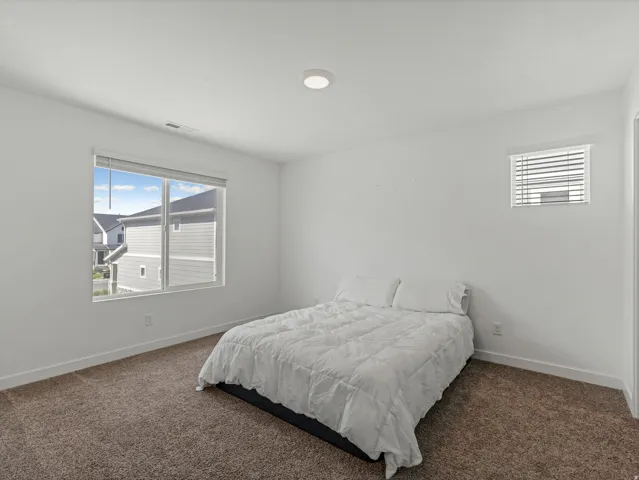 Neutral wall color with plush carpet flooring
