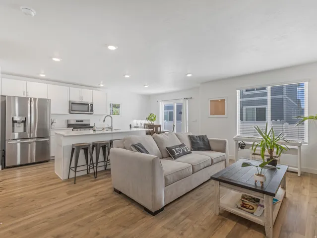 Open-concept living area featuring wood-finish flooring throughout