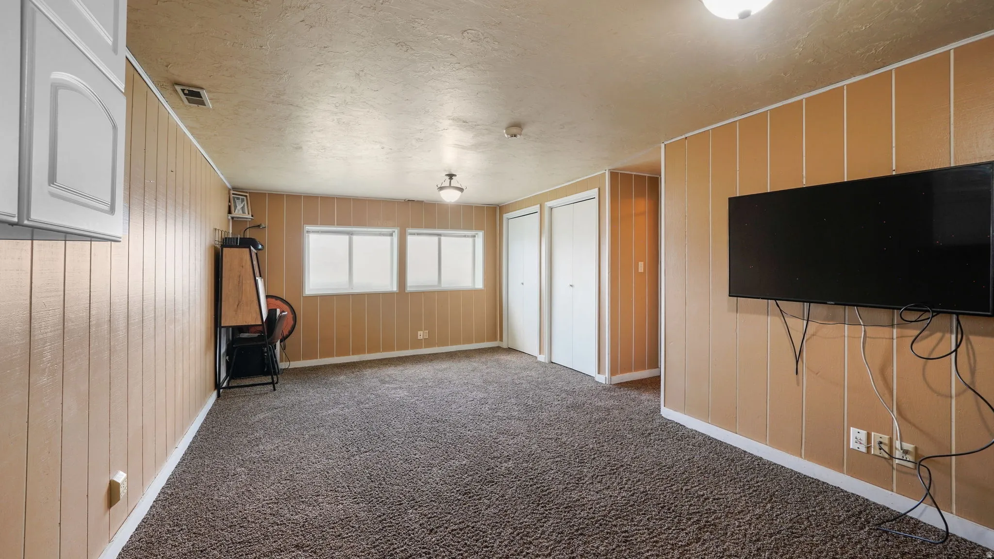 Large Family on Lower Level, Could easily put up one wall and a door and have a 4th BR