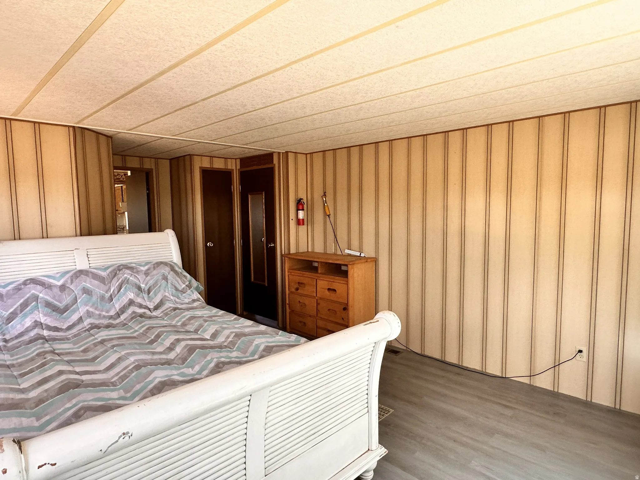 Interior space featuring wood-finish flooring and paneled walls