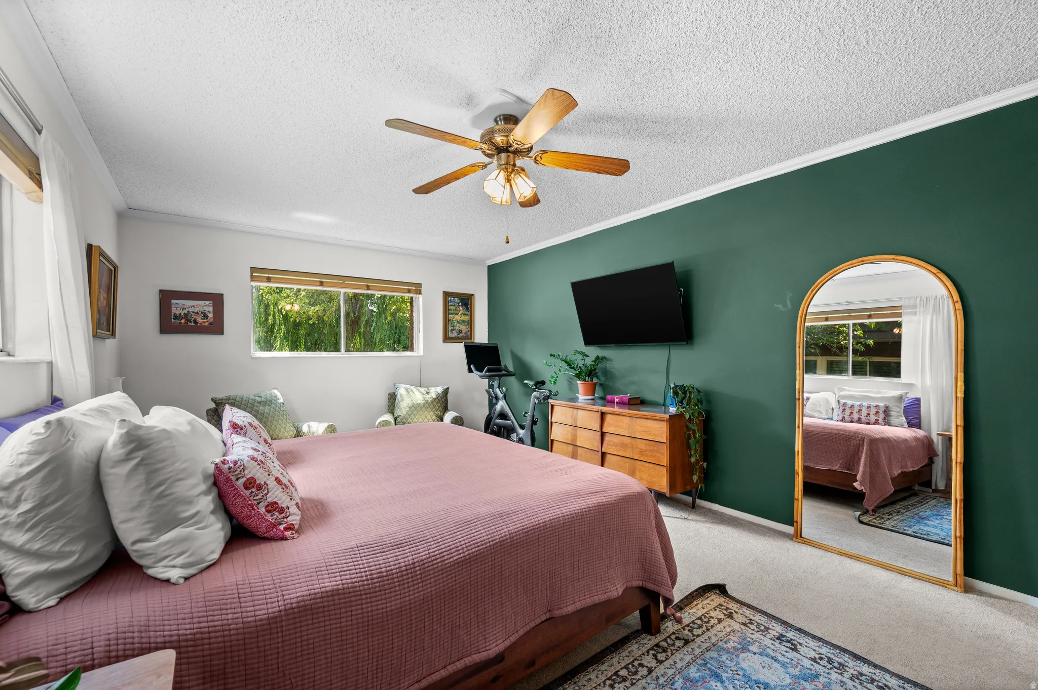 Bedroom with a distinctive green accent wall