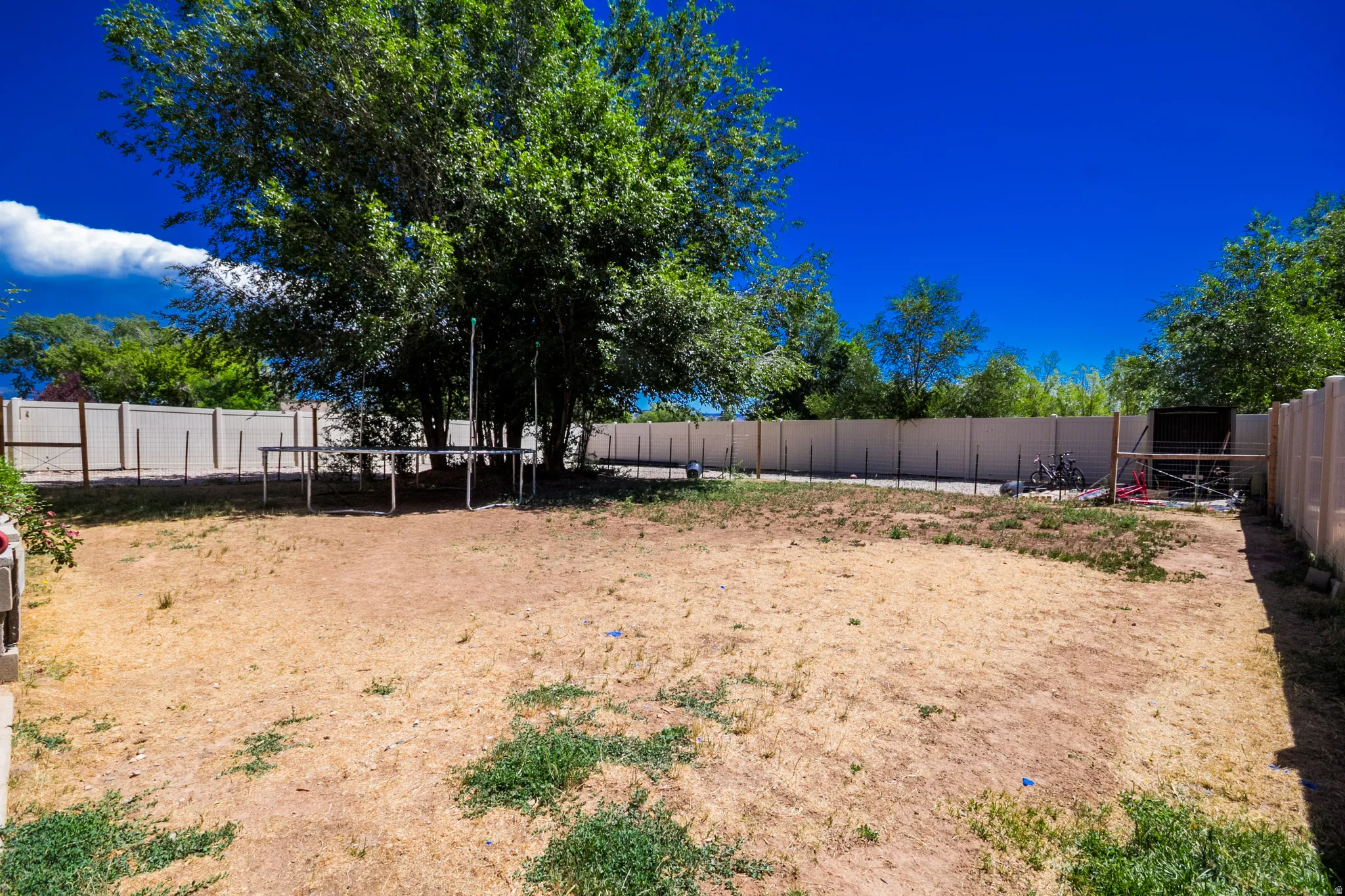 Fenced Backyard space ready for seed or turf.  Spinkler System installed and ready to water.  0