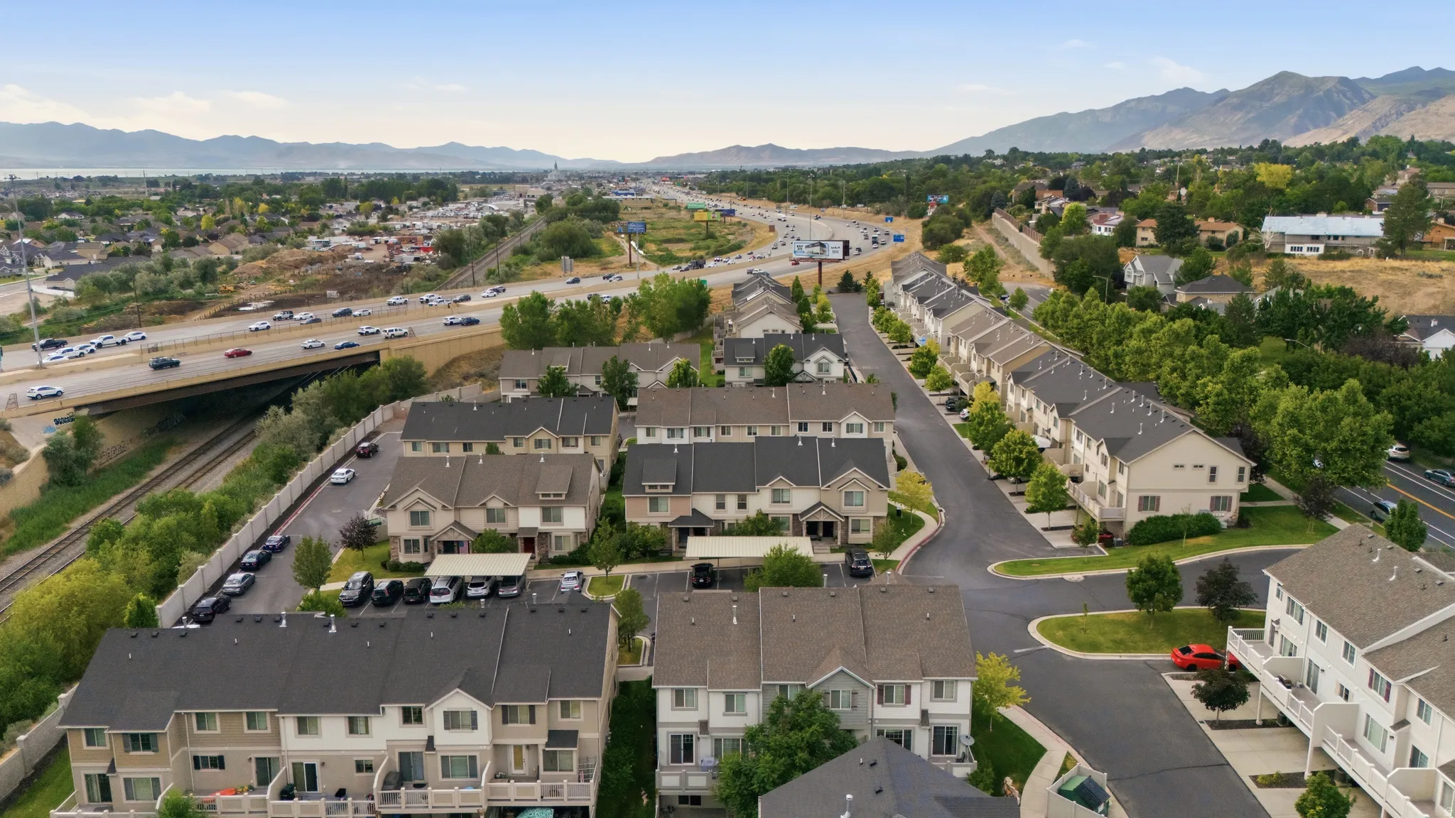 Aerial perspective showcasing a residential community with multi-level townhomes