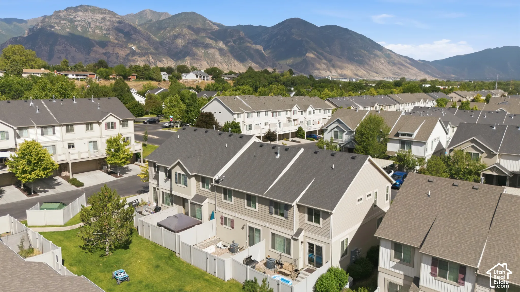 Townhome community featuring private fenced yards and a backdrop of expansive mountain ranges