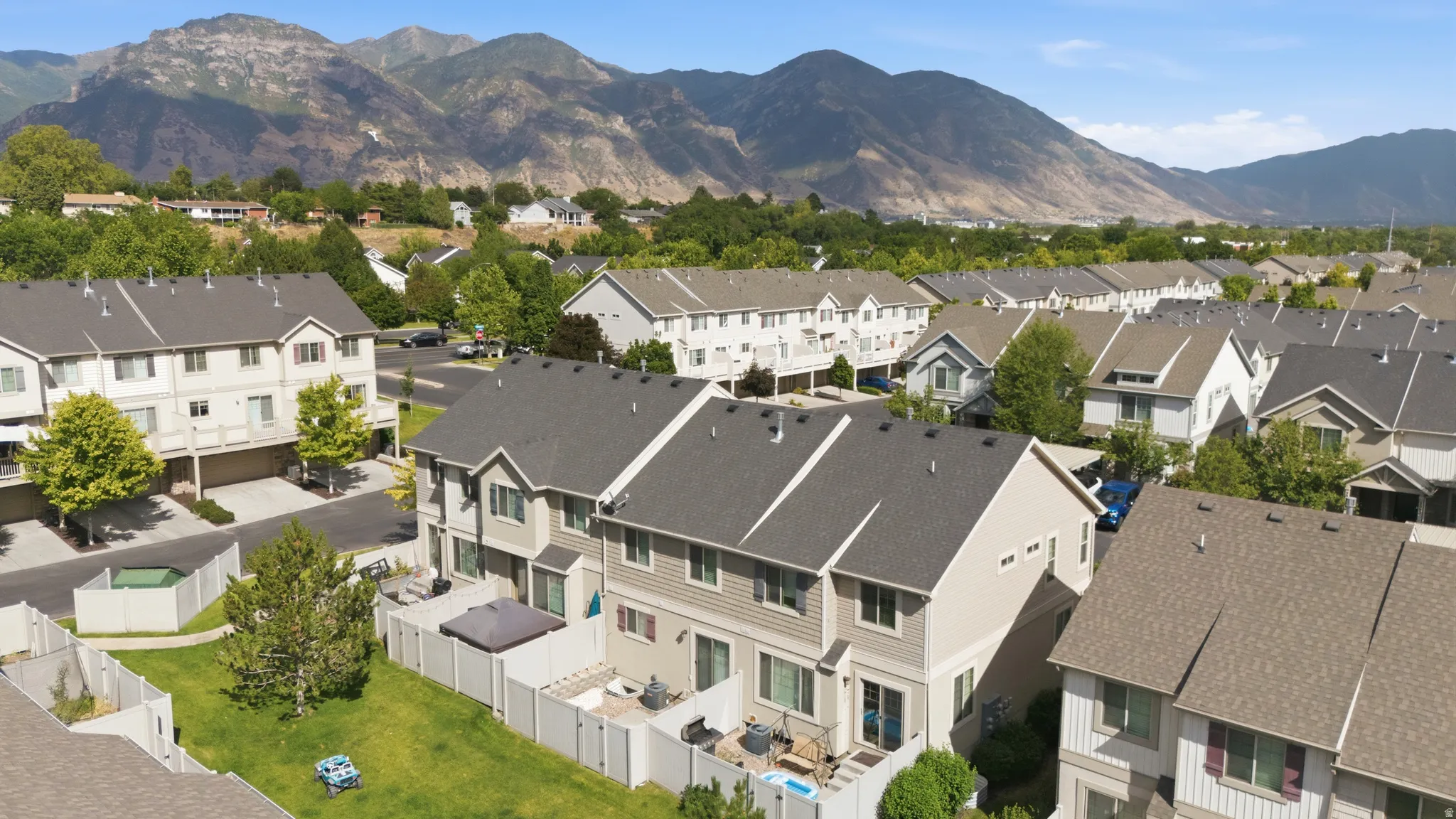 Townhome community featuring private fenced yards and a backdrop of expansive mountain ranges