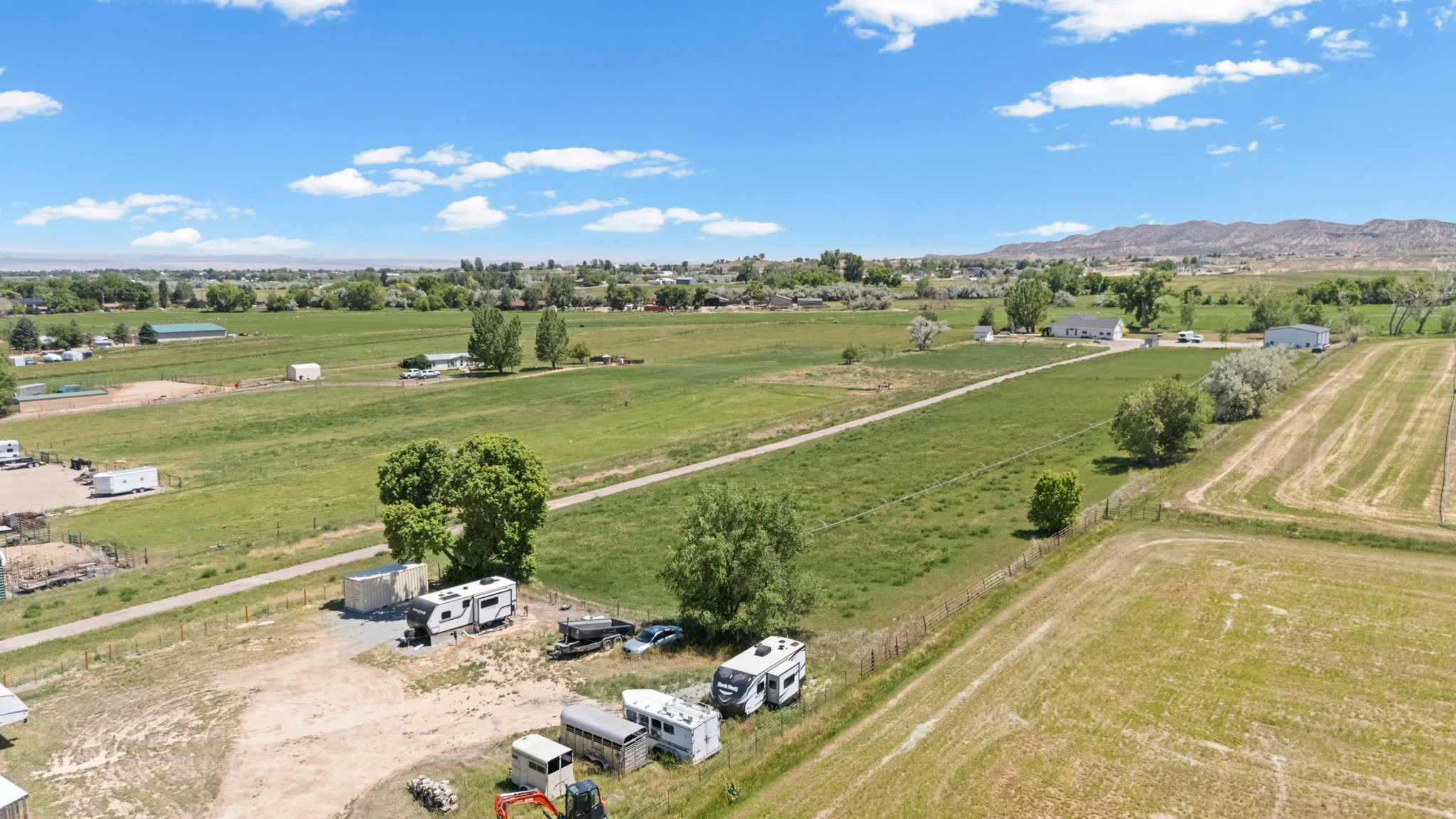 Expansive land parcel featuring open fields and distant mountain range