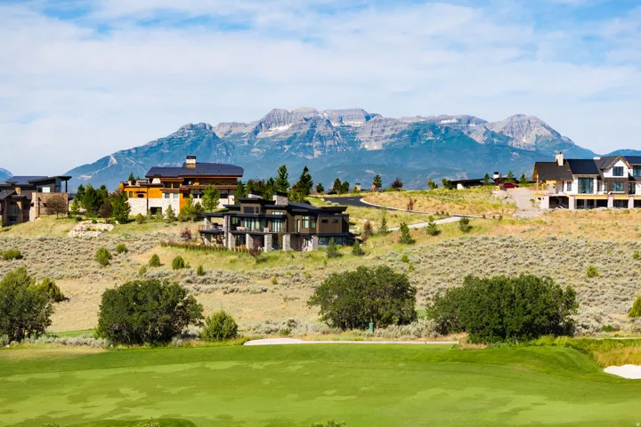 Expansive golf course frontage with a mountain backdrop