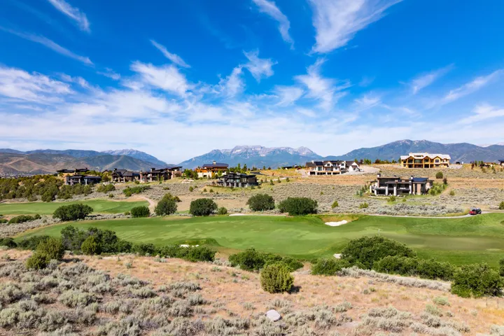 Expansive golf course frontage with manicured fairways and natural landscaping