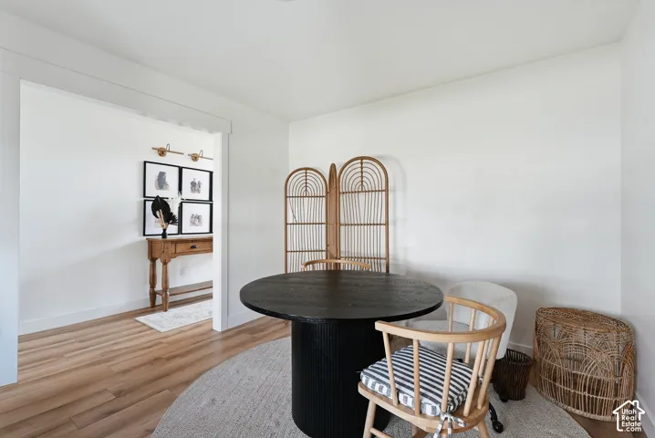 Open entry with wood-finish flooring and a wide doorway