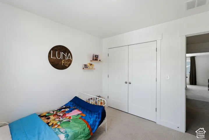 Carpeted room featuring white walls, white trim, and a white ceiling