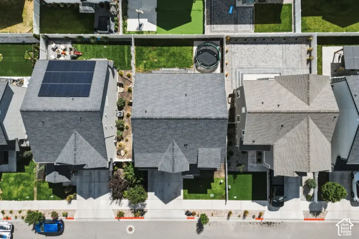 Aerial perspective showcasing three distinct residential properties