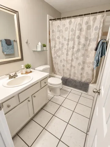 White tile flooring with dark grout lines