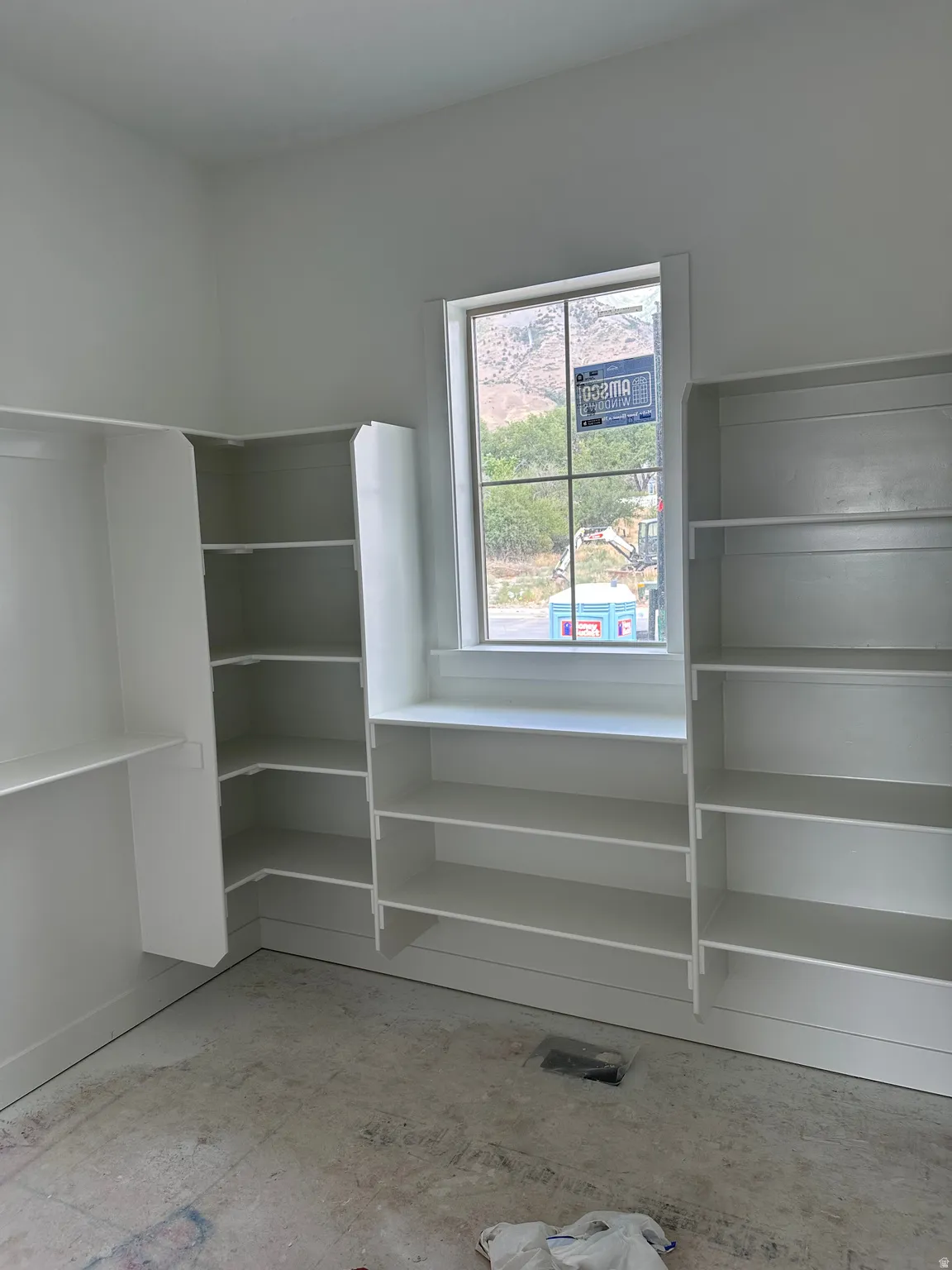 Built-in shelving units with white finishes