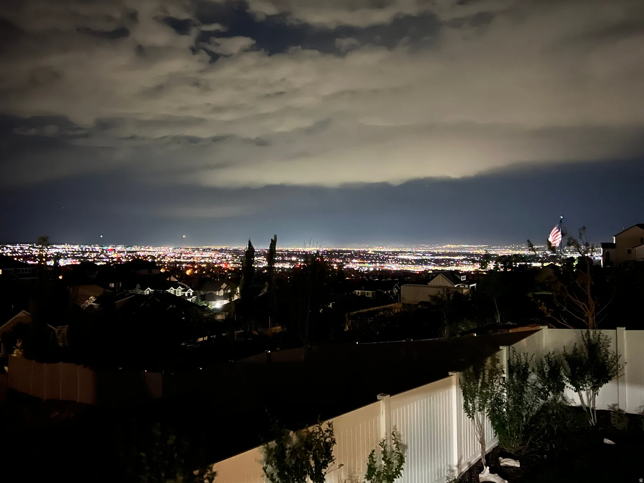 Panoramic nighttime views overlooking the valley and surrounding city lights.