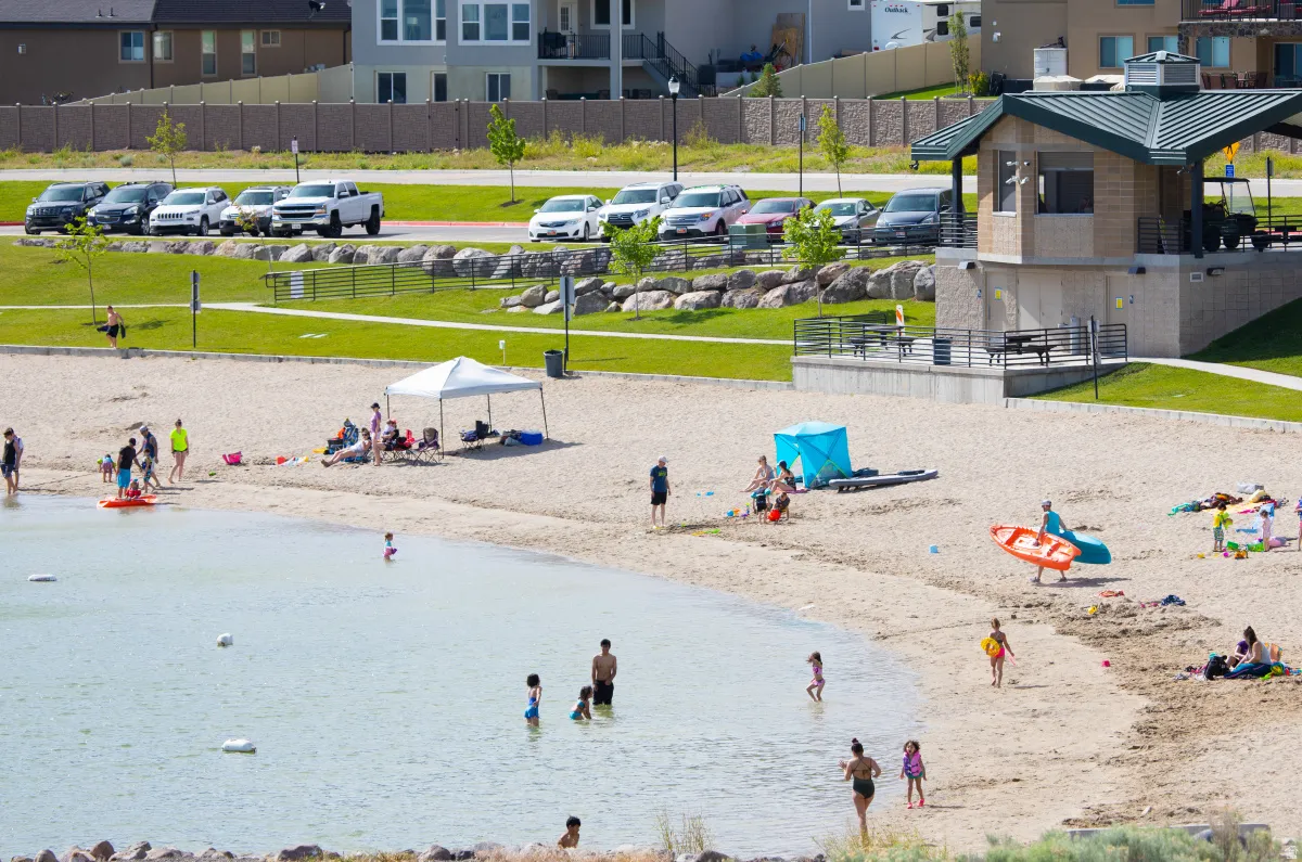 Blackridge Reservoir, just a short walk from the home, offering a sandy beach, swimming, paddleboarding, and beautiful mountain surroundings.