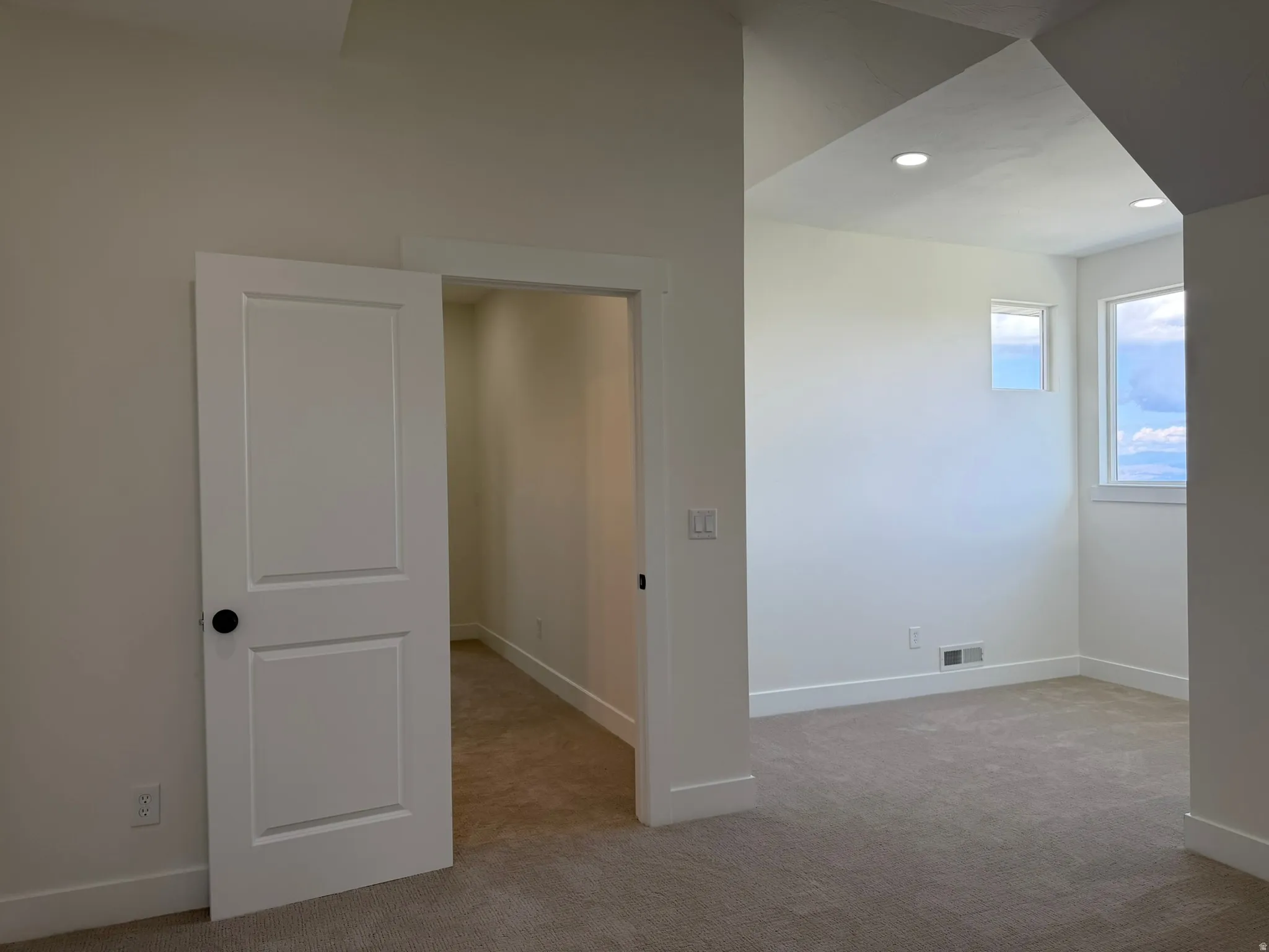 Upstairs bedroom which can also be used as a flex space for a loft office or large playroom with a private walk in closet.
