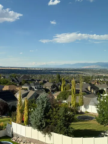 Sweeping daytime views overlooking the valley, mountains, and surrounding community.
