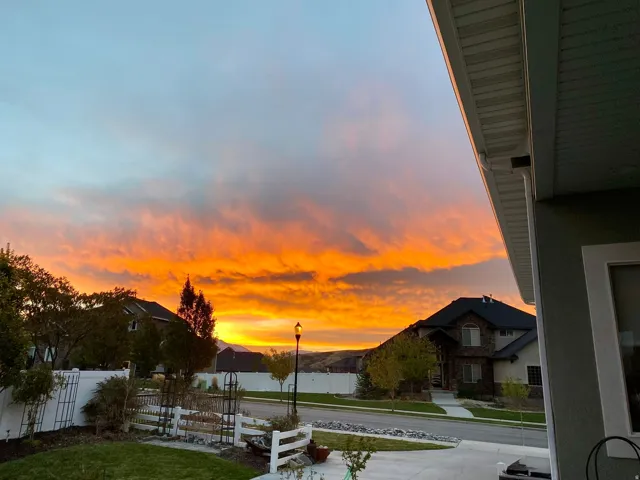 Colorful sunset views from the home’s elevated ridgeline setting.