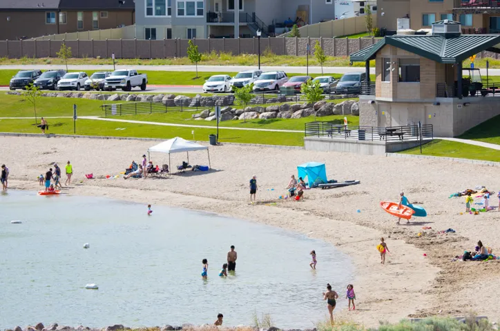 Blackridge Reservoir, just a short walk from the home, offering a sandy beach, swimming, paddleboarding, and beautiful mountain surroundings.