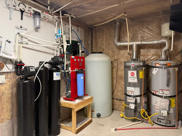 Water filtration system, water softener, two water heaters, and a large water storage tank