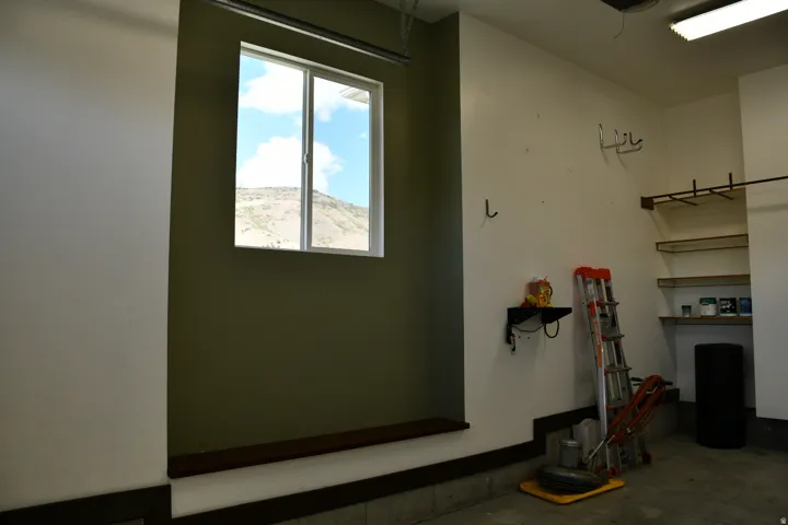 Integrated shelving system with wood-finish supports and wall-mounted storage options