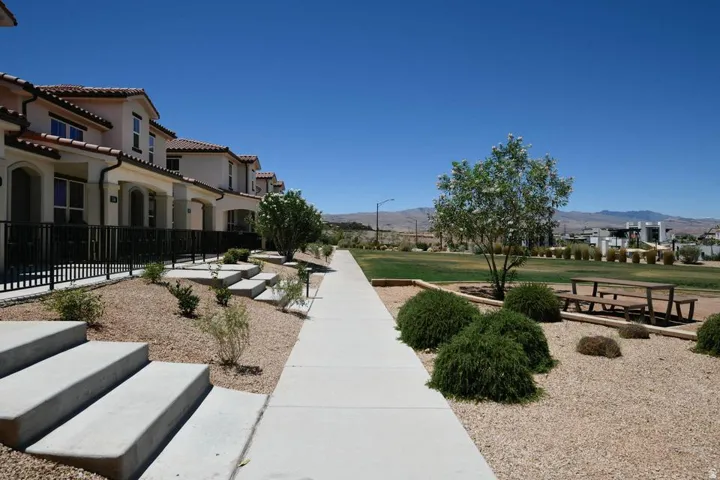 Row of townhomes featuring stucco facades and tile roofs