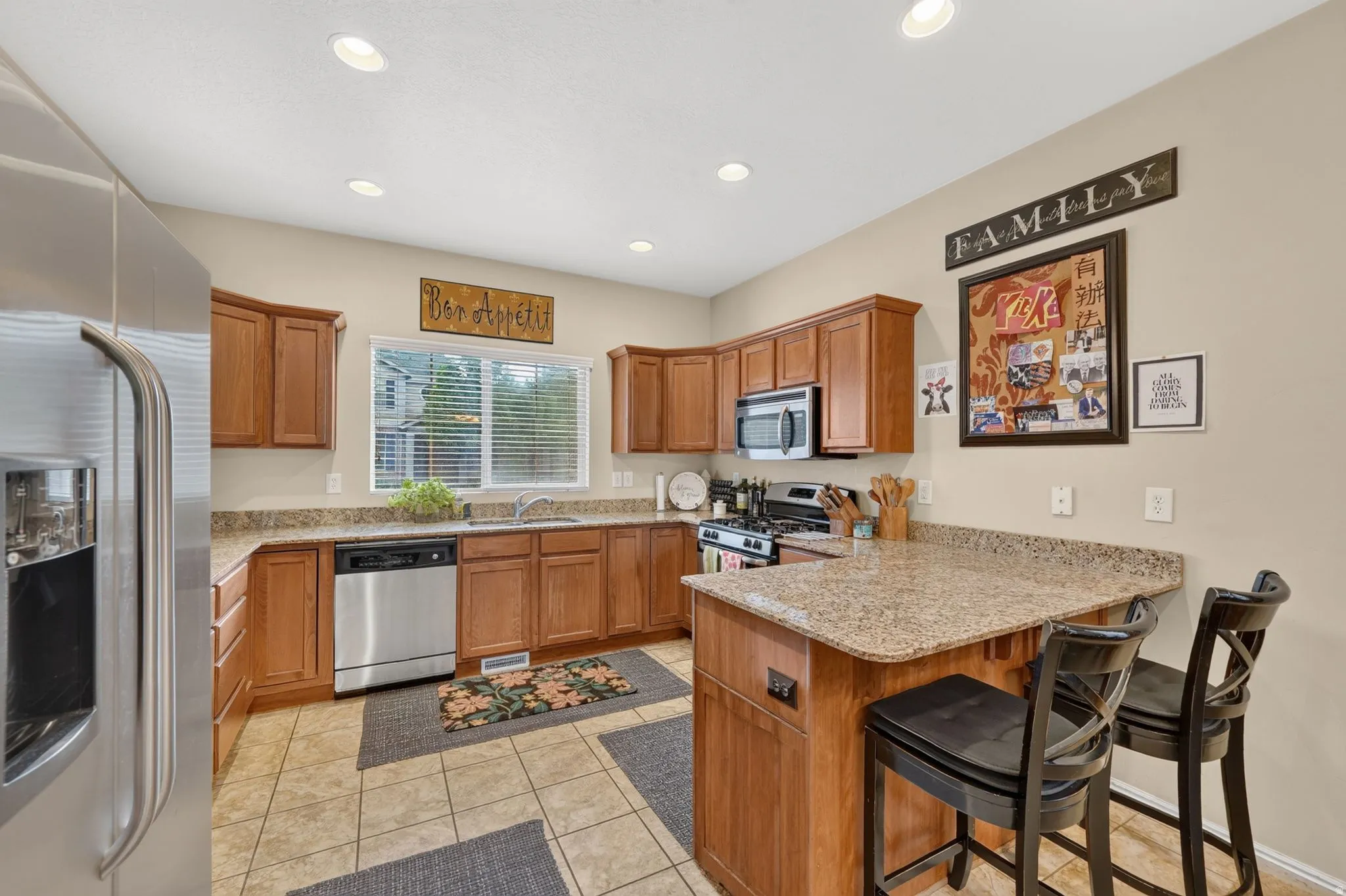 Kitchen featuring recessed lighting and wood-finish cabinetry