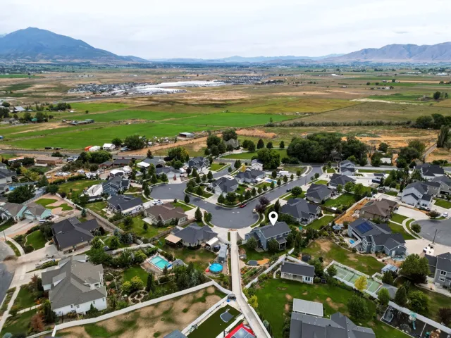 Aerial perspective showcasing a residential community with varied home styles and mature landscaping