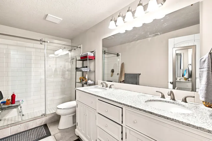Dual vanity with stone countertop and undermount sinks