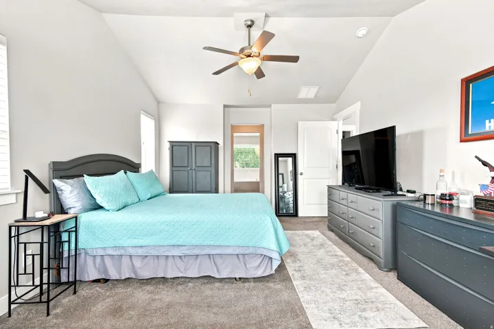 Vaulted ceiling with an illuminated ceiling fan