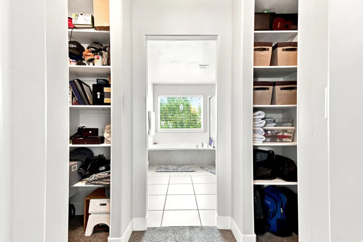 Hallway built-in shelving providing ample storage