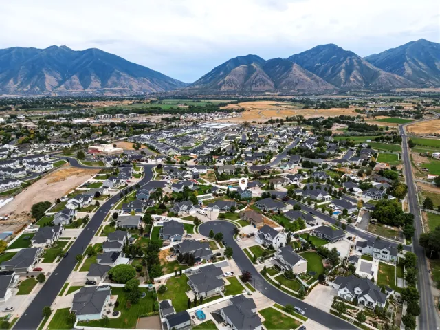 Aerial perspective of a residential neighborhood with mountain backdrop